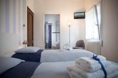 Кровать или кровати в номере La Casa di Amedeo