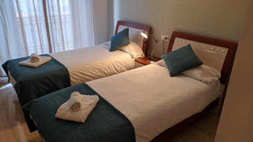 Llit o llits en una habitació de Life Apartments Alameda Colón