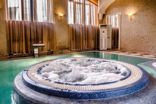 a large pool of water in a building at Gorny Ruchej in Hora