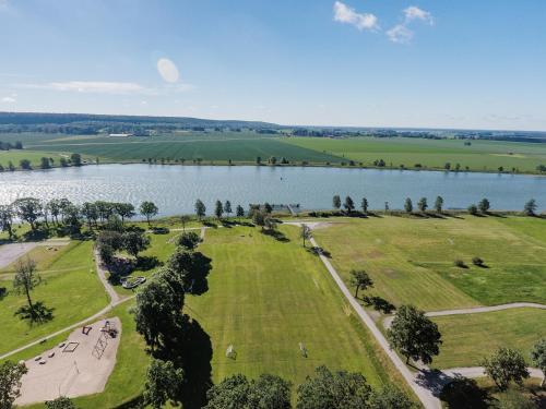 an aerial view of a park next to a lake at Hotel Hehrne Kök & Konferens in Vänersborg