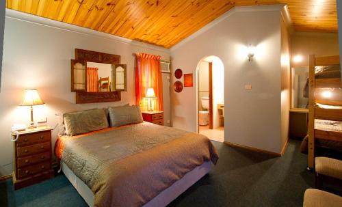 Postel nebo postele na pokoji v ubytování Riverwood Downs Of Barrington Tops