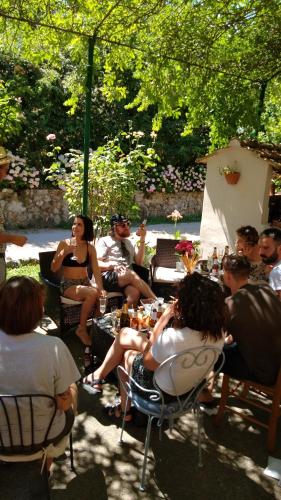 a group of people sitting in chairs in a park at Petalo Rosso b&b in Lenola