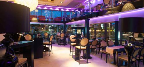 a restaurant with a bunch of tables and chairs at Central Budva apartment C15 in Budva