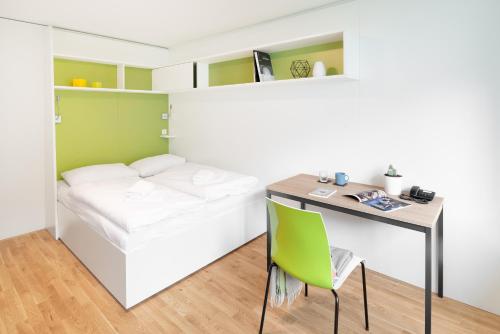 myNext - Hotel Leo tesisinde bir odada yatak veya yataklar