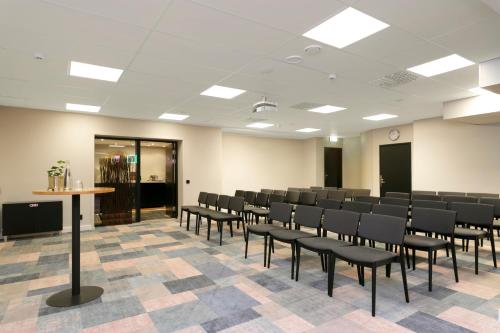 a conference room with chairs and a table in it at ProfilHotels Opera in Gothenburg