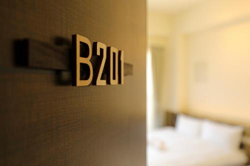 a sign that says bal on the wall of a hotel room at Cheese Cookie Homestay in Magong
