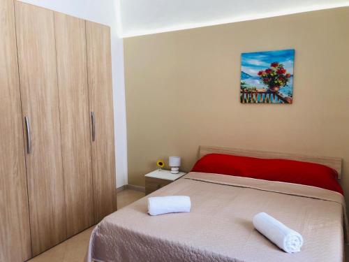 Ένα ή περισσότερα κρεβάτια σε δωμάτιο στο Casa Vacanze Zia Maria