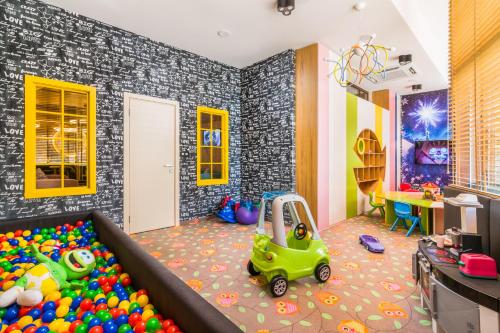 a childs play room with a large ball pit at Hotel Sevtopolis Medical & SPA in Pavel Banya
