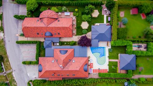 an overhead view of a house with a roof at Hotel Mayer Alsóörs in Alsóörs