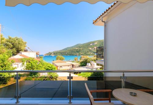 a balcony with a view of the water at Villa Regina in Keri