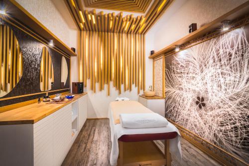 a bathroom with a sink and a toilet in it at Hotel Sevtopolis Medical & SPA in Pavel Banya