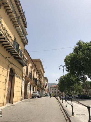 a street with cars parked on the side of a building at Residenza del Castillo in Palermo