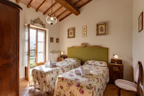 A bed or beds in a room at Podere Cerretino