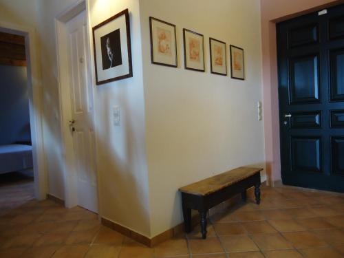 a hallway with a bench next to a door at STONE ROSE VILLA in Agios Ioannis
