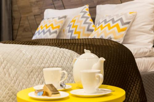 Postel nebo postele na pokoji v ubytování Giewont Krupówki SPA