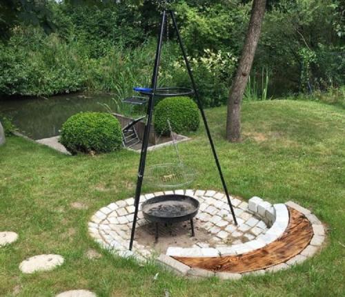 a fire pit in the middle of a yard at Ilmhaus in Pförring