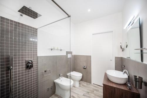 a bathroom with a sink and a toilet and a shower at B&B PROCHYTEA in Procida