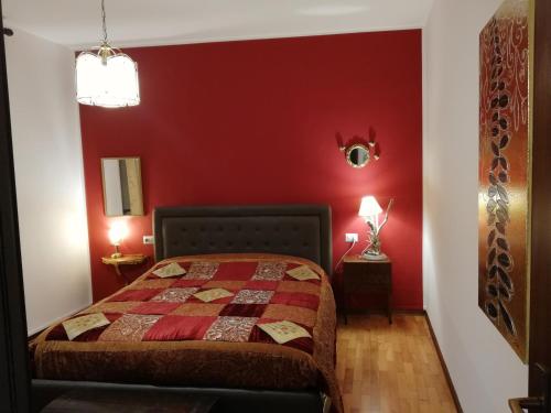 Кровать или кровати в номере Appartamento Collini