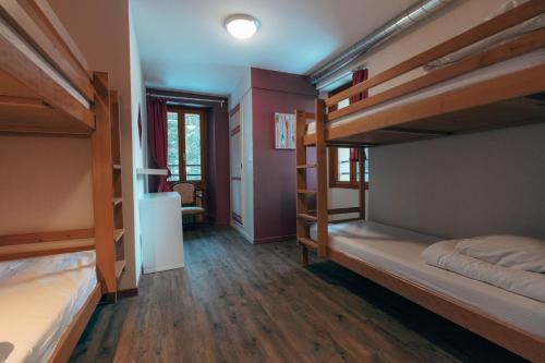 Voodi või voodid majutusasutuse 1861 Châtel Hostel toas