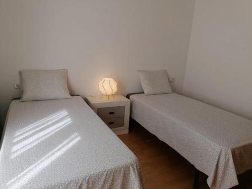 Säng eller sängar i ett rum på Apartamento Serreria de Boltaña