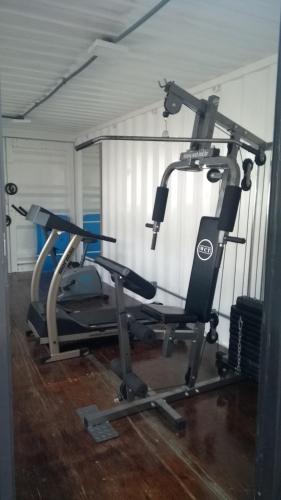 a gym with two exercise bikes in a room at Hotel Ville House Premium in Canoas