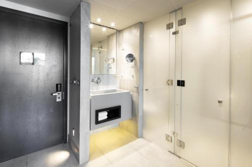 a bathroom with a sink and a shower at Ladera Boutique Hotel in Santiago