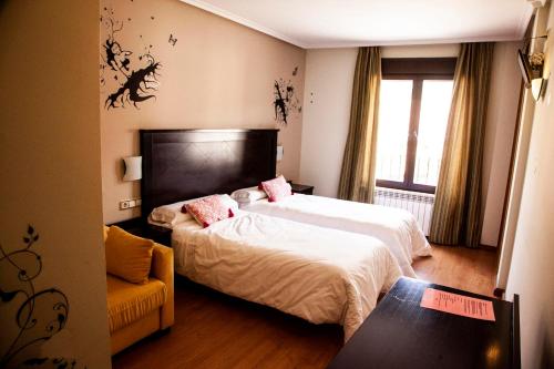 Postel nebo postele na pokoji v ubytování Hotel Rural Camero Viejo