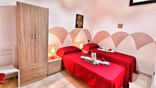 Posteľ alebo postele v izbe v ubytovaní B&b Villa Santa Sofia by holidayngo