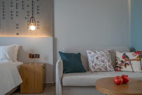 a living room with a couch and a table at ELIXIA in Tolo