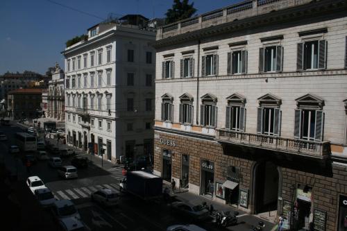 a view of a city street with buildings and cars at Hotel St. Moritz in Rome