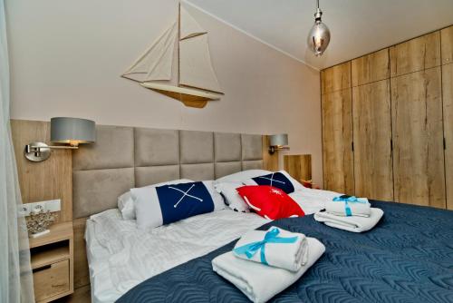 Katil atau katil-katil dalam bilik di BlueApart Apartamenty Na Plaży Jastarnia