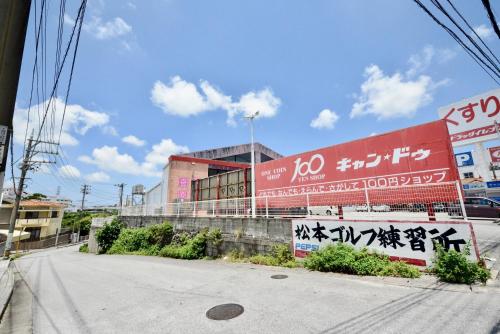 an empty street in front of a building at Allstay CHIBANA in Okinawa City