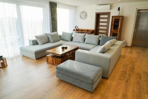 a living room with a couch and a table at Luxury Villa in Moravany nad Váhom