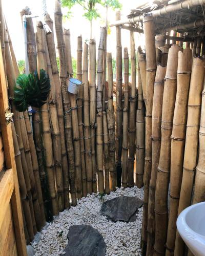 a bamboo fence in a bathroom with a sink at GuaiGüí Bayahibe in Bayahibe