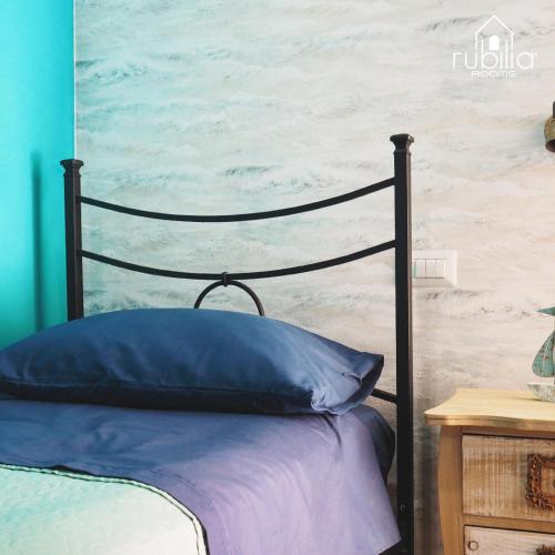 Ένα ή περισσότερα κρεβάτια σε δωμάτιο στο Rubilia Rooms Pompei