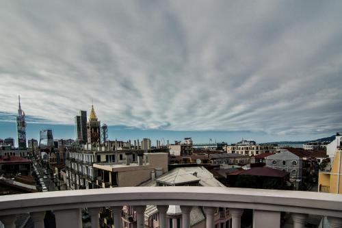 a view of a city from a balcony at Hotel London in Batumi