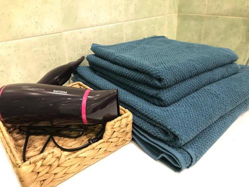 a basket of towels sitting on a counter with at Mariacki View Apartment in Gdańsk