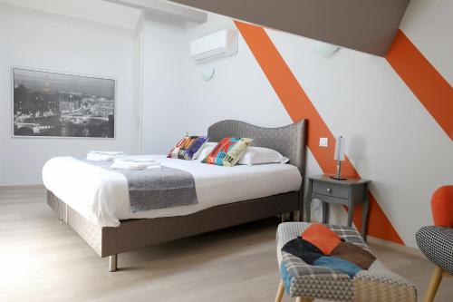 Un pat sau paturi într-o cameră la Le Porta 5