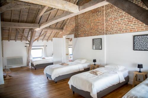 Säng eller sängar i ett rum på La Maison du Passavant (Gîte à la ferme)