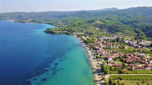an aerial view of a small island in the water at Perfect Suites in Neos Marmaras