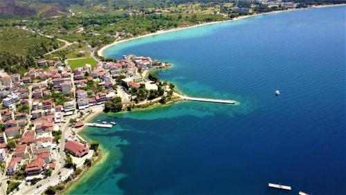 an aerial view of a small island in the water at Perfect Suites in Neos Marmaras