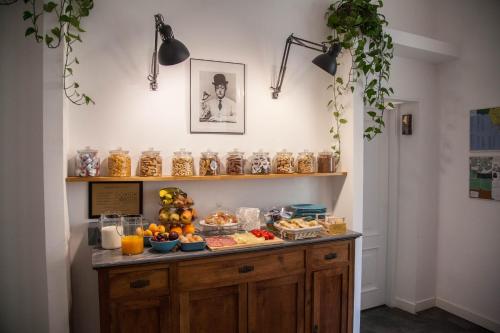a counter with food on it in a room at Borgo Vergini Garden B&B in Naples