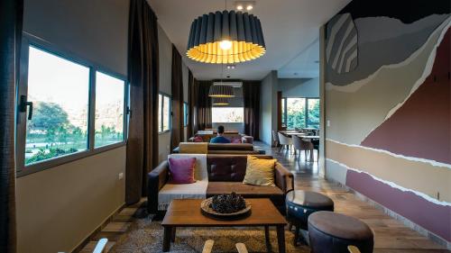 a living room with a couch and a table at Calina Casa de Huéspedes in Villa General Belgrano