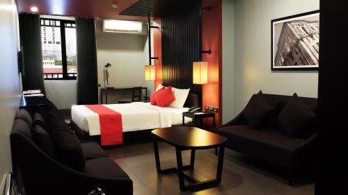 Voodi või voodid majutusasutuse Amelie Hotel Manila toas