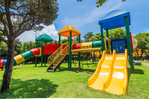 a park with a playground with slides and a slideintend at Kenting Maya-House B&B in Kenting