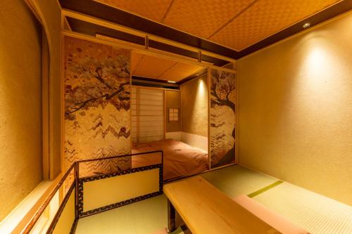 Postel nebo postele na pokoji v ubytování cyashitsu ryokan asakusa