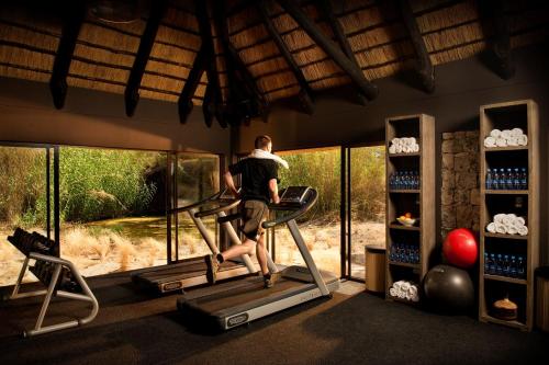 a man running on a treadmill in a gym at Mokuti Etosha in Namutoni