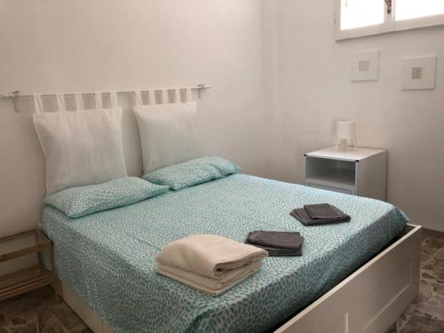 A bed or beds in a room at La casa di Mimì... calore e accoglienza!