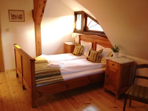 a bedroom with a large bed in a room at Pensjonat Dom Zegarmistrza in Bogatynia