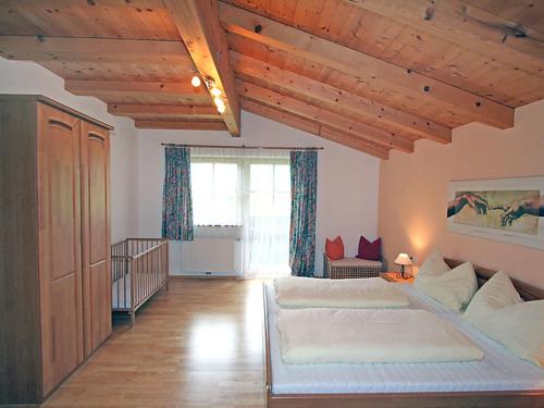 a large bedroom with two beds and a window at Ferienhaus Flatscher in Lofer